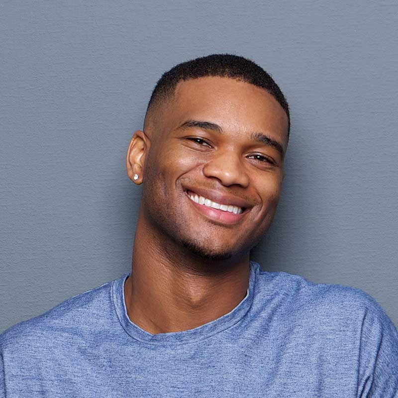 young african american man smiling PXCKH6R