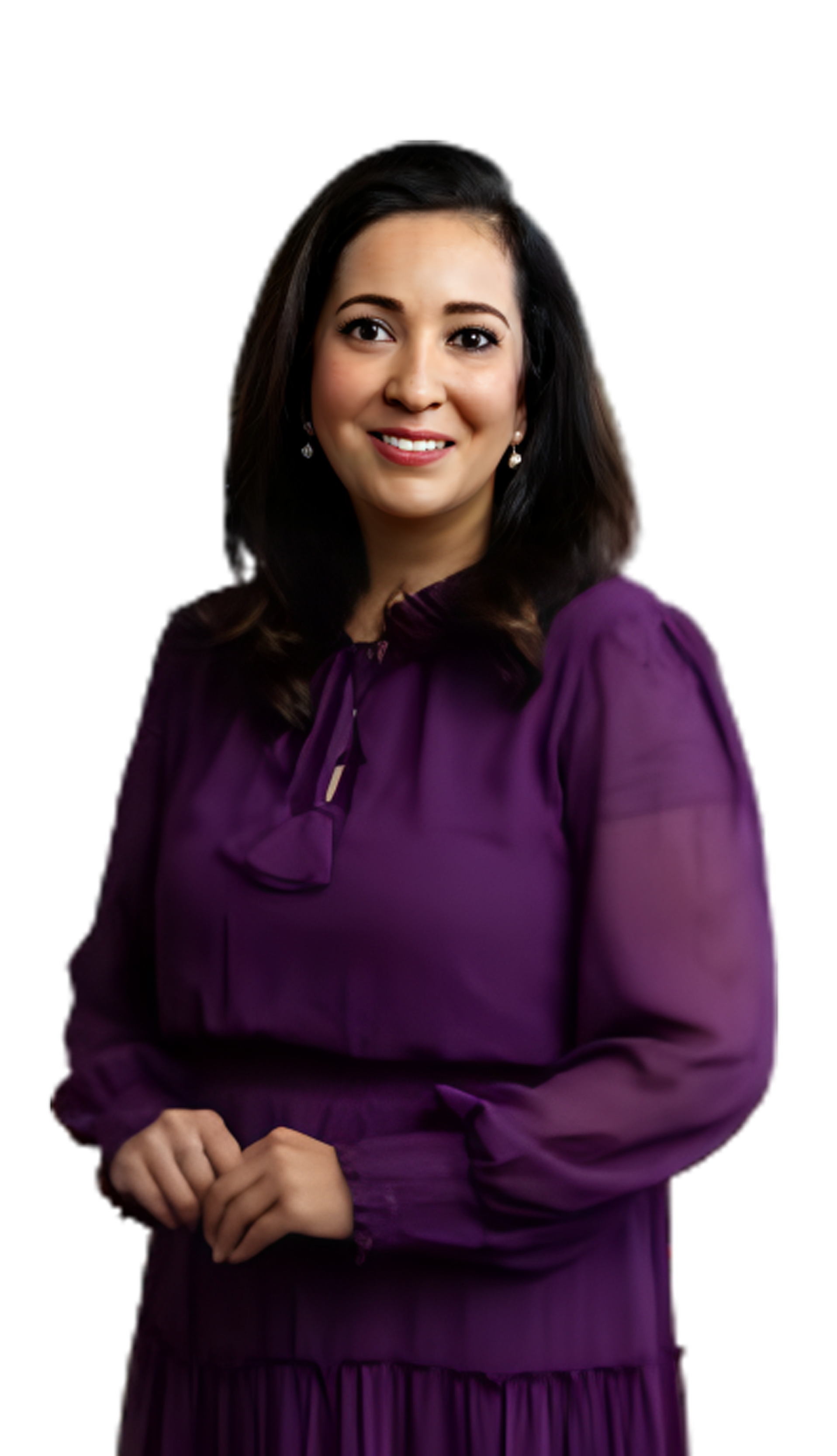 Dr. Sophia Rahman smiling in a purple suit, with black hair and eyes, offering compassionate healthcare in Plano, TX